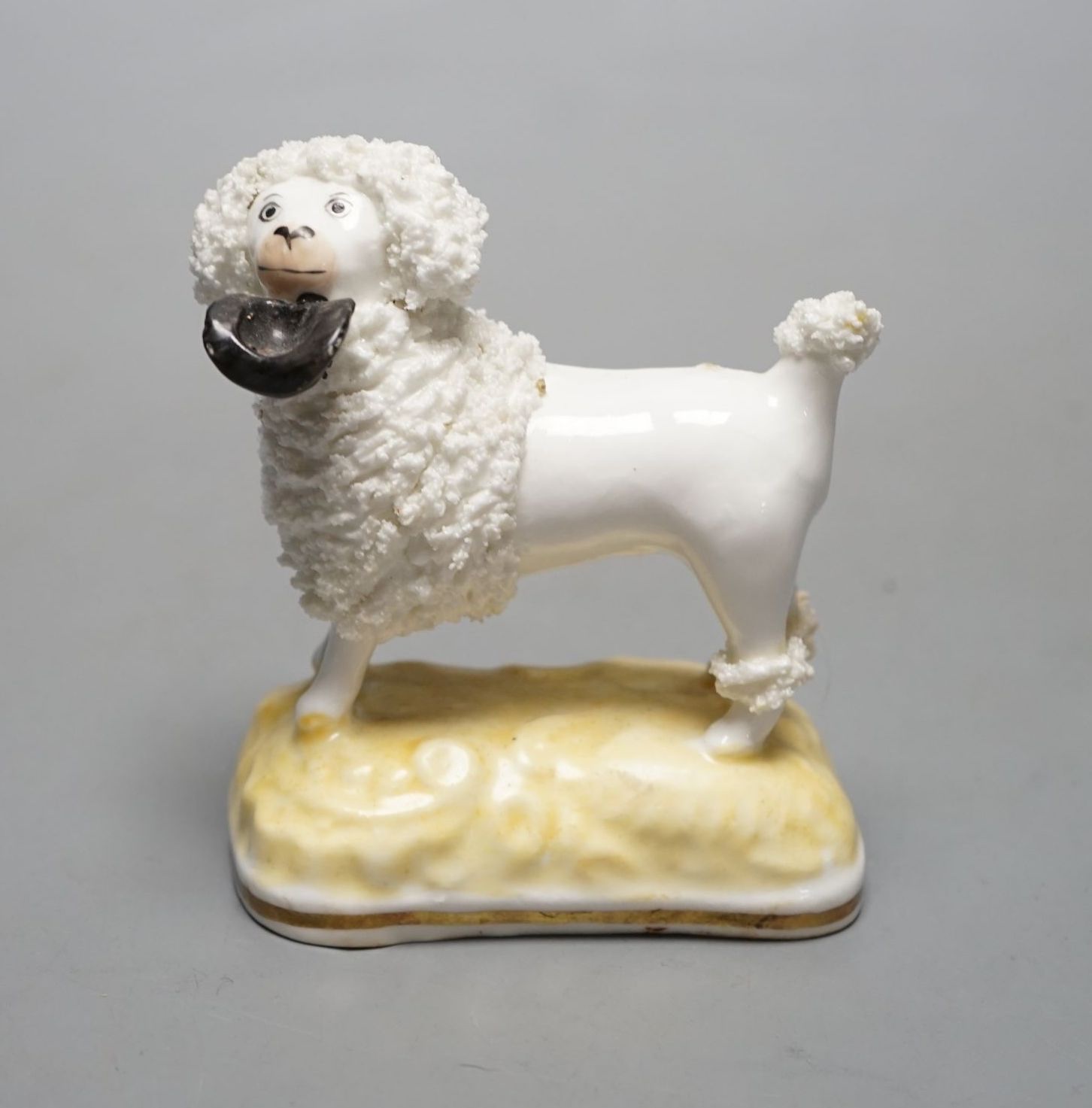 A rare Samuel Alcock porcelain figure of a standing poodle holding a hat in its mouth, c.1835-50, impressed ‘17’, Provenance: Dennis G. Rice collection, apparently an unrecorded model when Dr Rice published his book., 8.